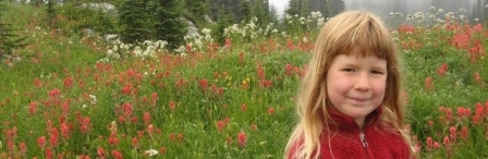 young woman in wild flower field