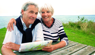 smiling couple at picnic table