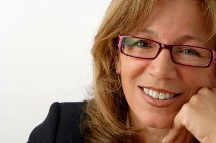 business woman with glasses smiling