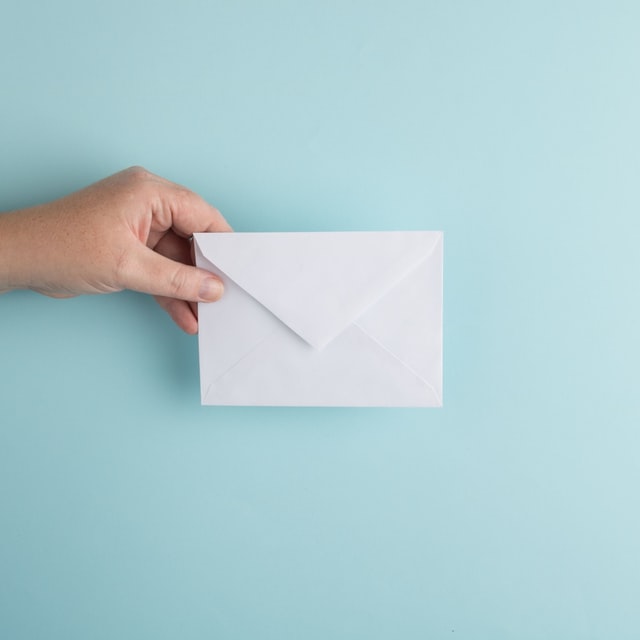 Picture of a hand holding an envelope