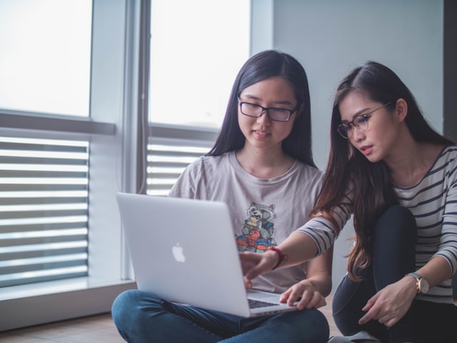 Picture of two women looking at a computer