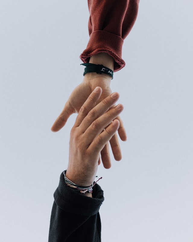 Picture of hands reaching for each other