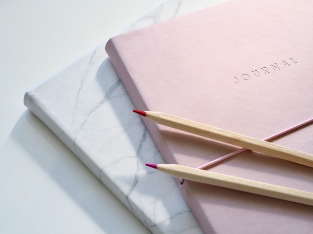 Picture of a journal and pencils