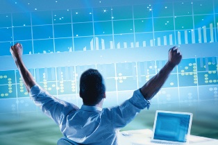 man raising arms in front of stock screen